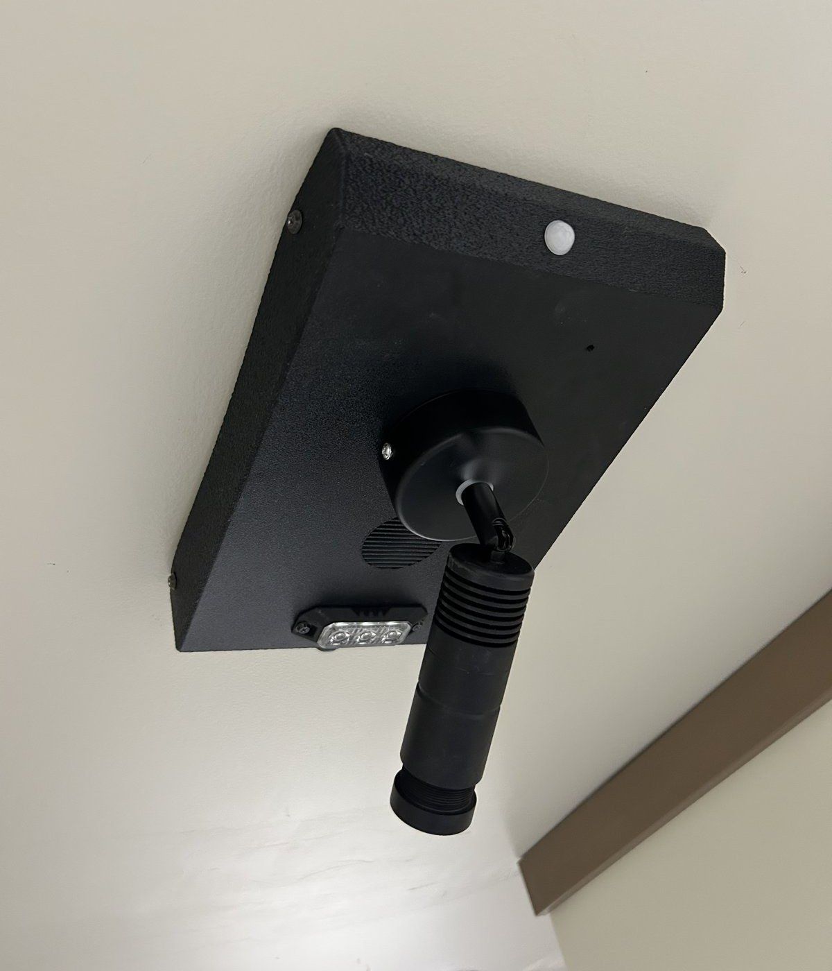 Safety Illuminator Ceiling Mount Model on the ceiling with its projector, motion sensor and lights